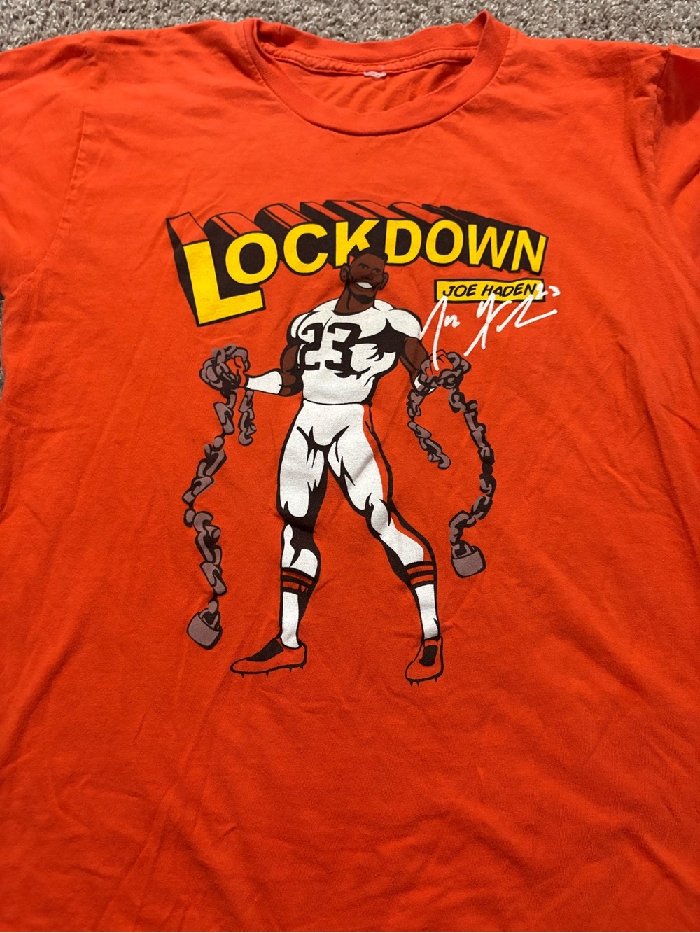 Joe Haden “Lockdown Haden 23" Orange Graphic Men’s T-Shirt